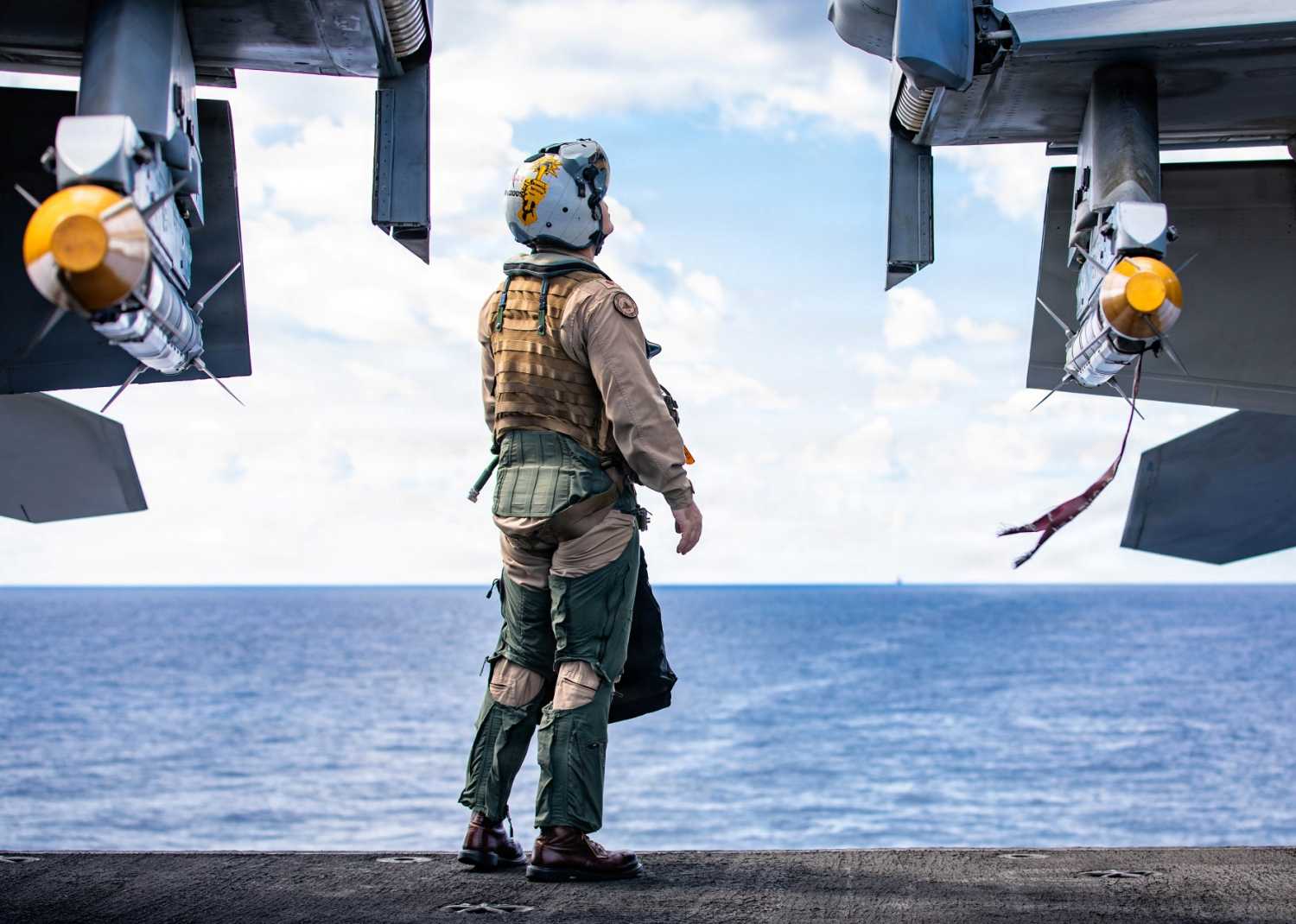 In this handout released by the U.S. Navy, a sailor conducts preflight checks on an F/A-18E Super Hornet aircraft, attached to Strike Fighter Squadron 87, aboard the USS Gerald R. Ford (CVN 78), while operating in support of Operation Epic Fury on March 2, 2026 in the Eastern Mediterranean Sea.
