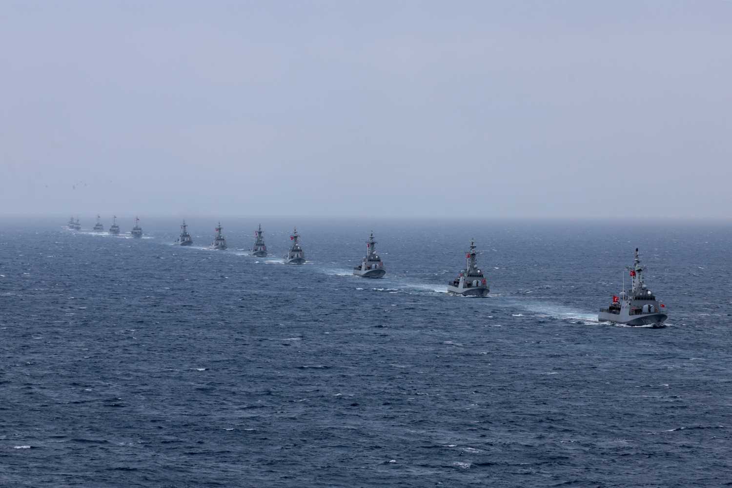 Turkey's Kilic class TCG Kilic (P-330) (R) and fast attack warships participate in the live-fire phase of the "Blue Homeland-2026" (Mavi Vatan) tactical military exercises in the eastern Mediterranean Sea, in Antalya on April 9, 2026.