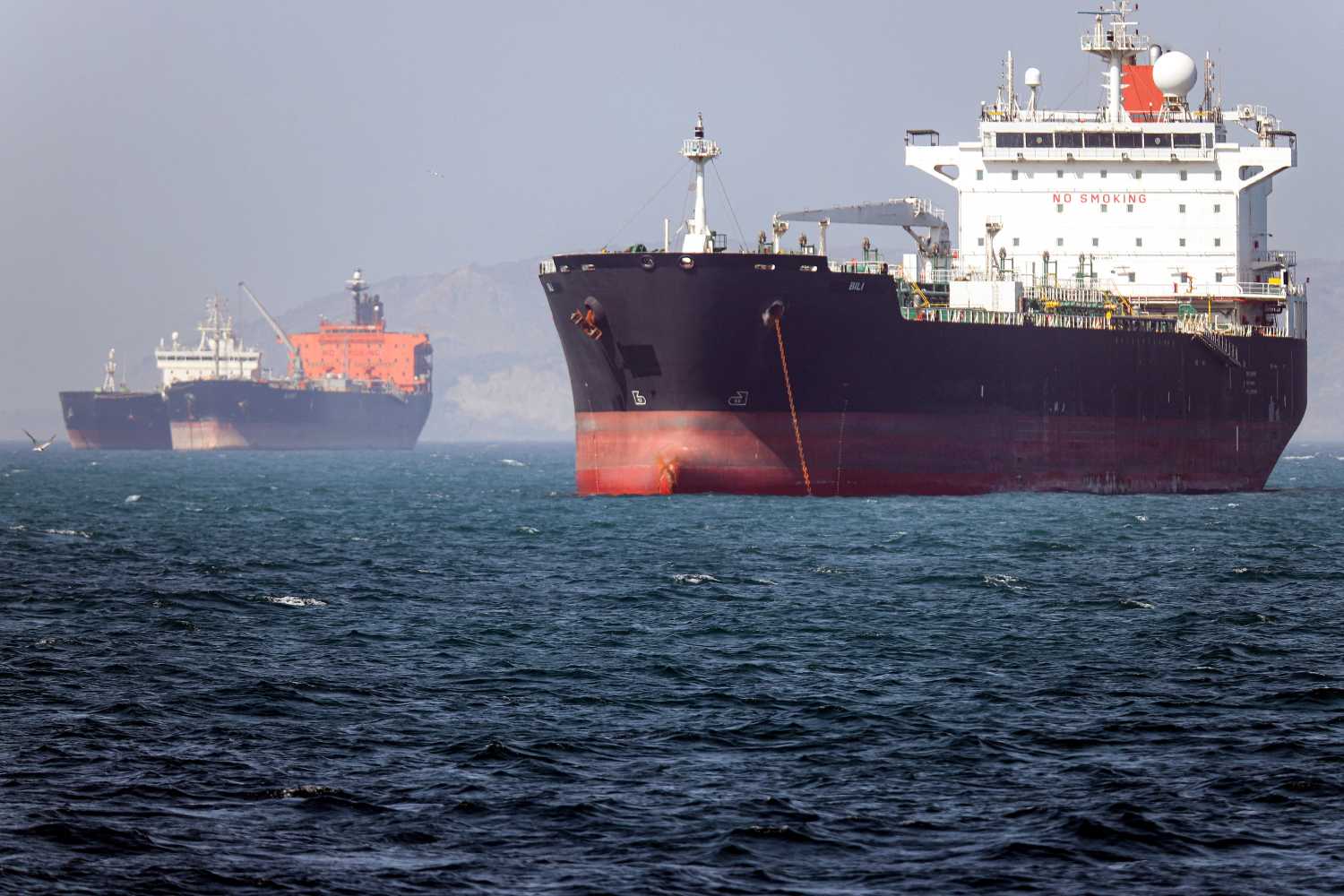 In this picture obtained from Iran's ISNA news agency and taken on May 2, 2026, the Gambia-flagged tanker vessel Bili is pictured anchored in the Strait of Hormuz off Bandar Abbas in southern Iran.