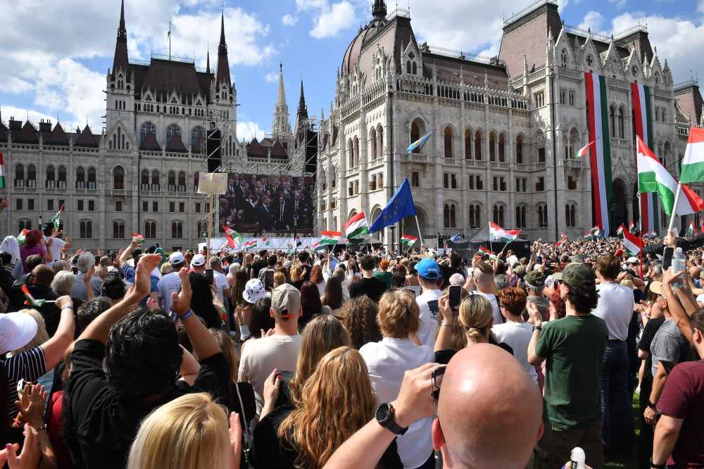 People attend Hungary's Prime Minister Peter Magyar's swearing-in ceremony outside the Hungarian parliament in Budapest on May 9, 2026.