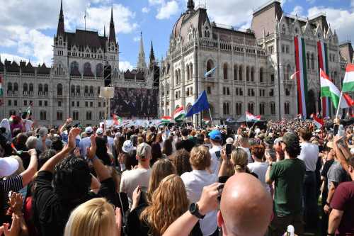 People attend Hungary's Prime Minister Peter Magyar's swearing-in ceremony outside the Hungarian parliament in Budapest on May 9, 2026.
