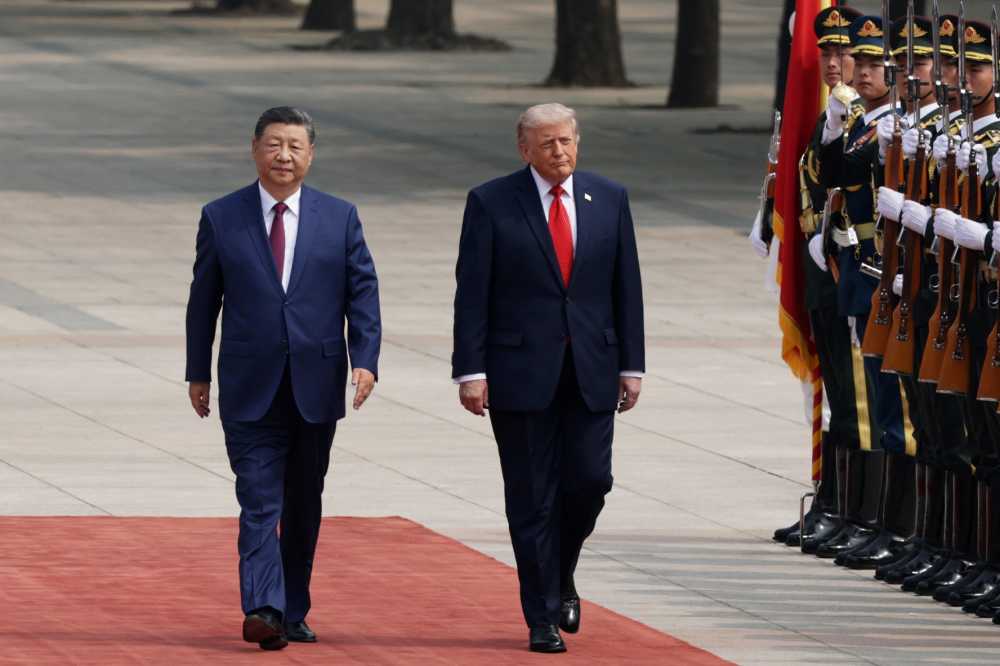 U.S. President Donald Trump reviews an honor guard with Chinese President Xi Jinping during a welcome ceremony at the Great Hall of the People on May 14, 2026 in Beijing, China.