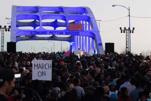 SELMA, AL - JANUARY 18: A view of marchers as they assemble on the Edmund Pettus Bridge to commemorate the life of Dr. Martin Luther King Jr. on Jan. 18, 2015, in Selma, Alabama.