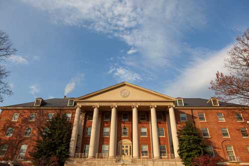 Exterior view of the main historic building of National Institutes of Health (NIH) inside Bethesda campus