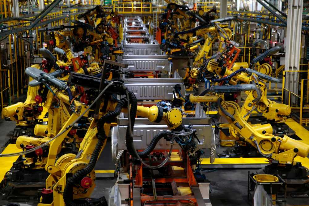 Truck beds for the Ford 2018 and 2019 F-150 are welded in the body shop at the Ford Motor Company's Rouge Complex on September 27, 2018 in Dearborn, Michigan. - Ford Motor Company's Rouge complex is the only one in American history to manufacture vehicles including ships, tractors and cars non-stop for 100 years. (Photo by JEFF KOWALSKY / AFP) (Photo credit should read JEFF KOWALSKY/AFP via Getty Images)