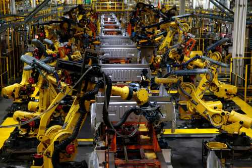 Truck beds for the Ford 2018 and 2019 F-150 are welded in the body shop at the Ford Motor Company's Rouge Complex on September 27, 2018 in Dearborn, Michigan. - Ford Motor Company's Rouge complex is the only one in American history to manufacture vehicles including ships, tractors and cars non-stop for 100 years. (Photo by JEFF KOWALSKY / AFP) (Photo credit should read JEFF KOWALSKY/AFP via Getty Images)