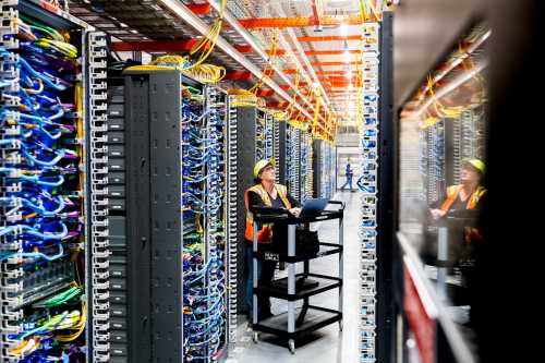 NEW CARLISLE, INDIANA - OCTOBER 2: In this handout provided by Amazon, a technician works at an Amazon Web Services AI data center in New Carlisle, Indiana on October 2, 2025.