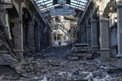 A man makes his way through the heavily damaged historic market of Nabatieh on June 15, 2026.
