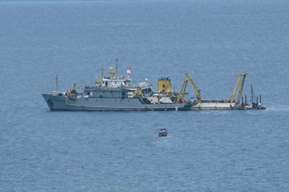 Ships identified by the Philippine Coast Guard as Chinese research vessels are seen at Scarborough Shoal in the disputed South China Sea on June 15, 2026.