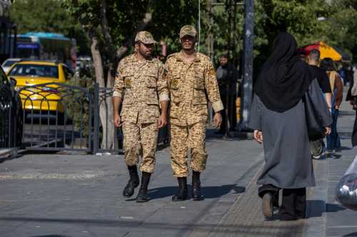 TEHRAN, IRAN - JUNE 15: Military soldiers are seen walking on a street in Tehran on June 15, 2026 in Tehran, Iran.