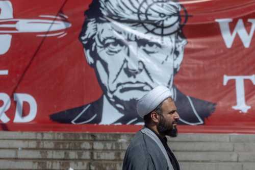 eople pass a large banner depicting U.S. President Donald Trump with a target on his head, during funeral ceremonies for Iran's slain Supreme Leader, Ayatollah Ali Khamenei, at the Grand Mosalla on July 5, 2026 in Tehran, Iran.