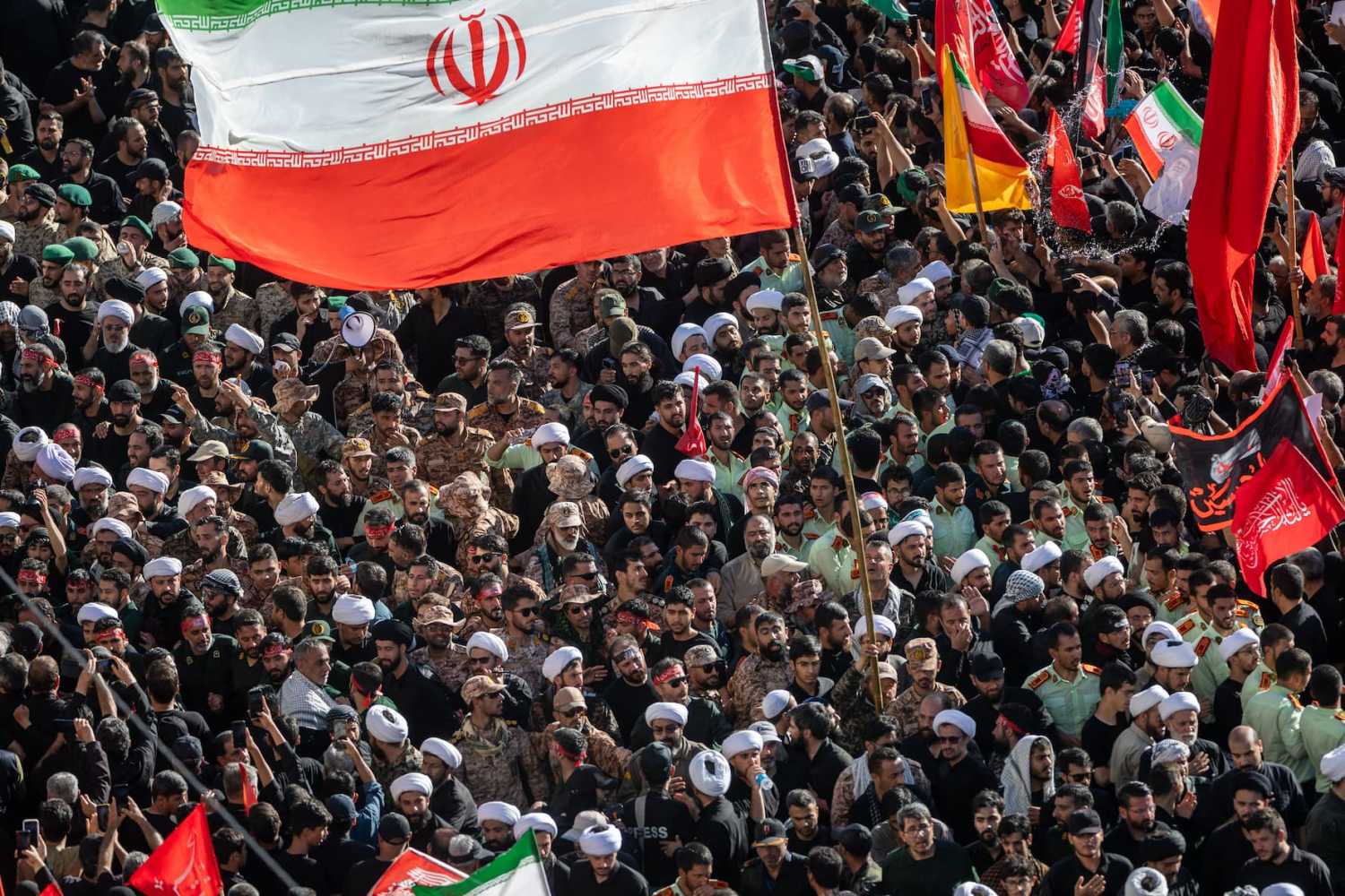 MASHHAD, IRAN - JULY 09: Iranian Revolutionary Guard soldiers and clerics walk in the procession carrying the coffin of Iran's slain Supreme Leader Ayatollah Ali Khamenei on July 9, 2026, in Mashhad, Iran.