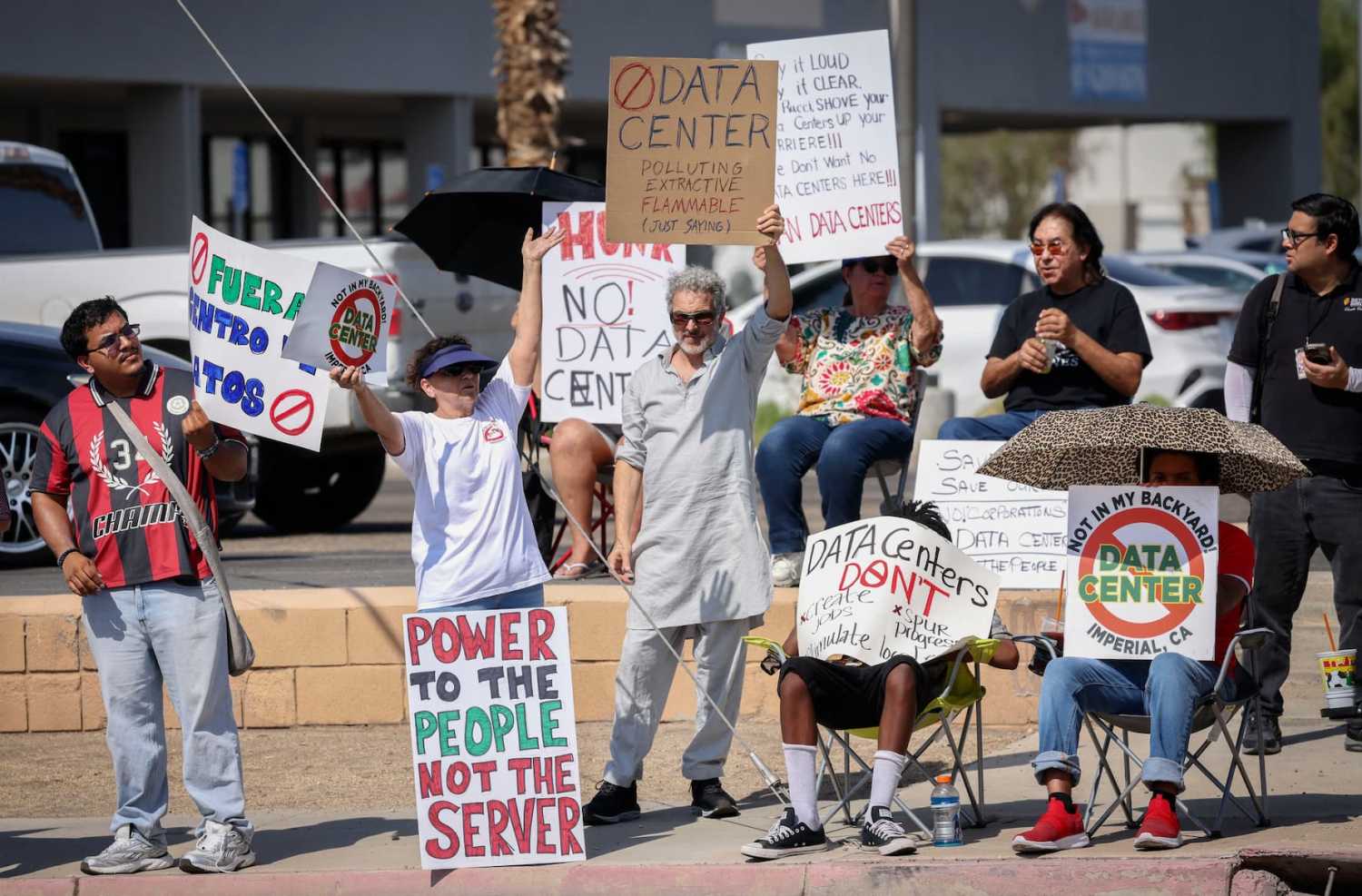 Demonstrators wave signs during a nationwide protest against AI data center expansion in Imperial, California on July 18, 2026.