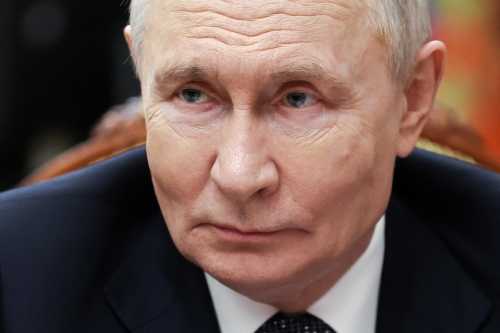 In this pool photograph distributed by the Russian state agency Sputnik, Russia's President Vladimir Putin meets with Moscow-installed leader of the Russian-controlled parts of the Zaporizhzhia region, at the Kremlin in Moscow on July 20, 2026.