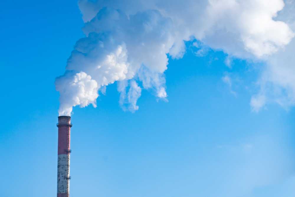 Smokestack against blue sky