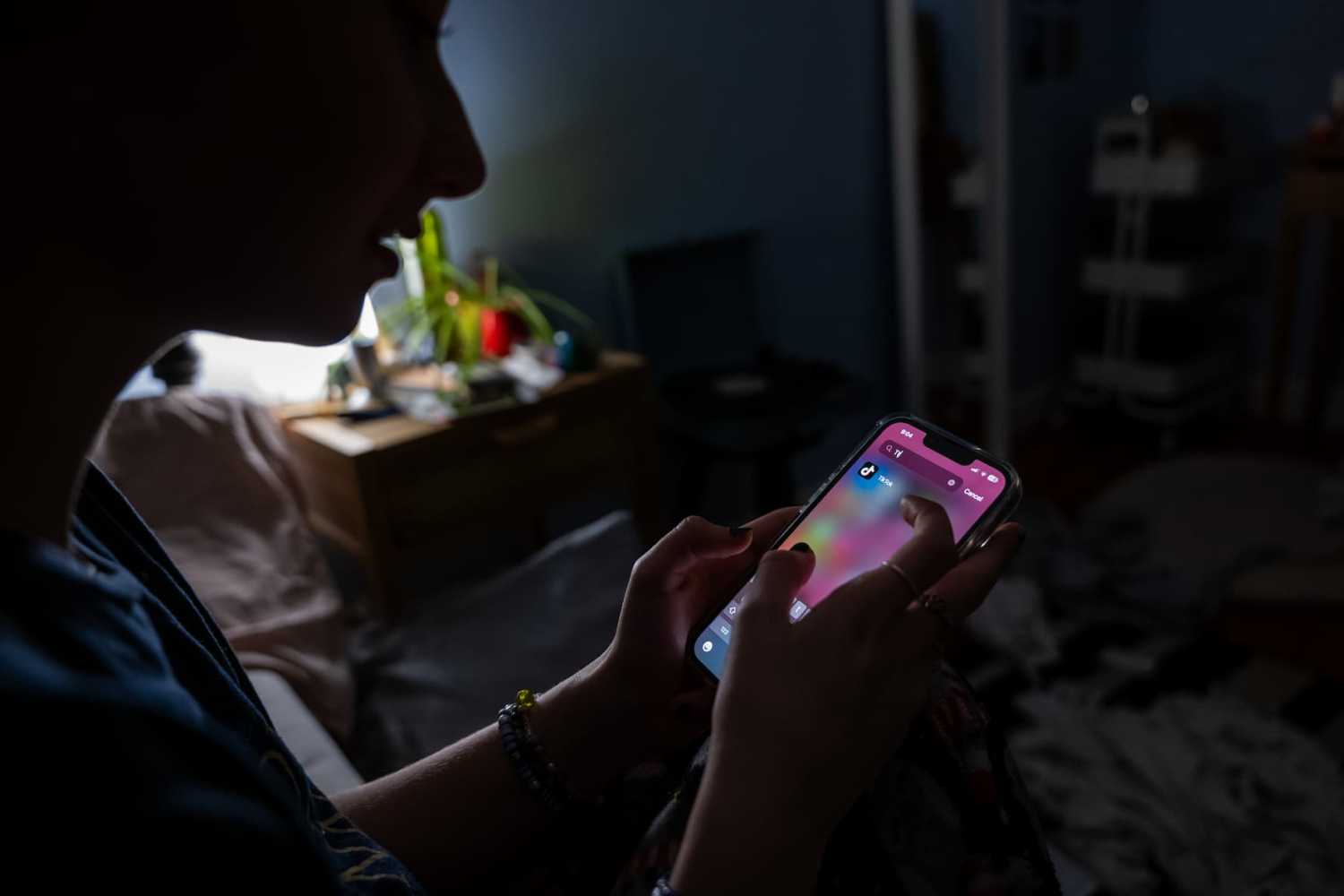 NEW YORK, NEW YORK - JANUARY 31: In this photo illustration, a teenager uses her mobile phone to access social media on January 31, 2024 in New York City.