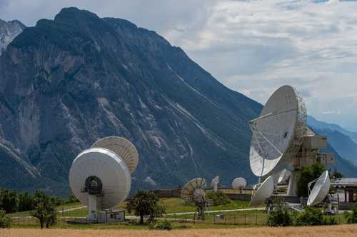 LEUK, SWITZERLAND - JULY 2: Satellite dishes belonging to local communications provider Leuk Teleport and Data Centre AG stand on a mountainside in Wallis canton on July 2, 2025, near Leuk, Switzerland. SpaceX, owned by Elon Musk, is reportedly seeking to build 40 satellite dishes for the Starlink satellite network at the site, with construction to possibly begin in September.