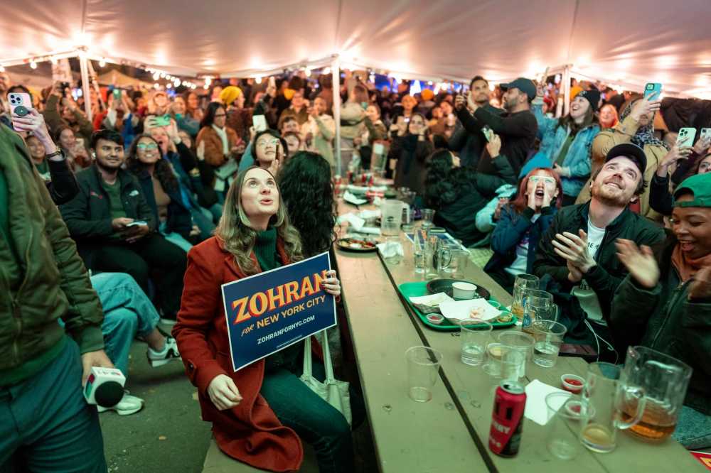 NEW YORK, NEW YORK - NOVEMBER 4: Supporters watch Democratic mayoral candidate Zohran Mamdani give his victory speech on television at an election-night watch party at the Bohemian Hall & Beer Garden on Nov. 4, 2025, in the Queens borough of New York City. The watch party was one of many hosted by the New York City chapter of the Democratic Socialists of America in support of Mamdani.