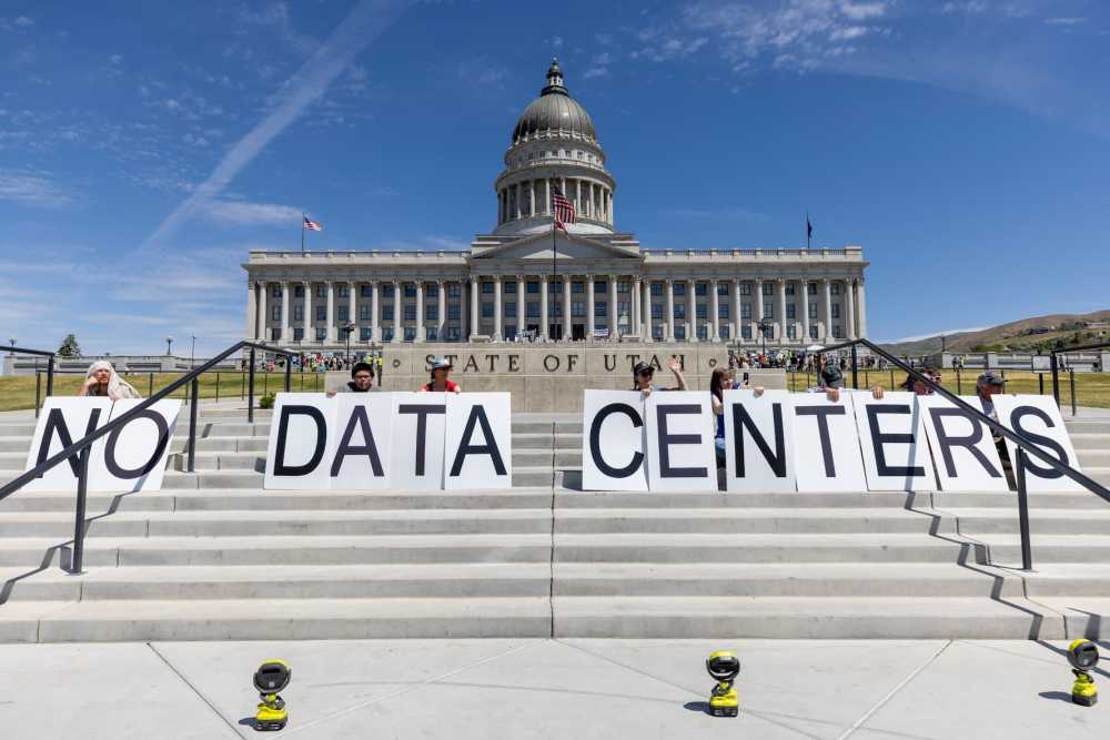 SALT LAKE CITY, UTAH - MAY 23: Demonstrators take part in a protest at the Utah State Capitol to oppose the construction of the Stratos data center in Box Elder County on May 23, 2026 in Salt Lake City, Utah. The proposed data center would be about 40,000 acres and is speculated to use 9 gigawatts of power.