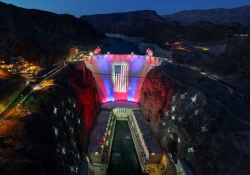 A 300-foot-wide by 150-foot-tall American flag is suspended across the Hoover Dam on June 30, 2026 in the Lake Mead National Recreation Area, Nevada. Beginning on Memorial Day, Nevada, Arizona and the federal Bureau of Reclamation partnered with the Las Vegas Convention and Visitors Authority to hang the 45,000-square-foot, 2,000-pound flag and illuminate it and the surrounding canyon walls with a patriotic lighting display nightly at dusk, pending high winds, through July 4, 2026, to mark the 250th anniversary of the United States Declaration of Independence.
