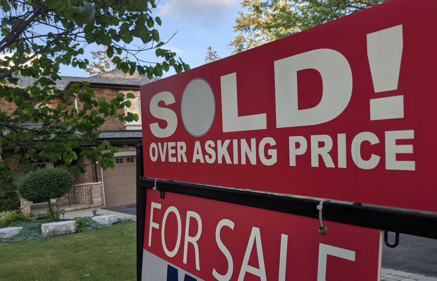 Sign on front lawn: "Sold over asking price"