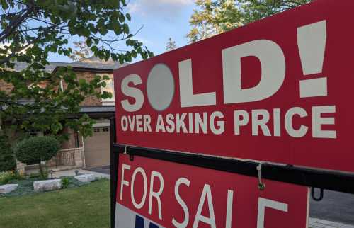 Sign on front lawn: "Sold over asking price"