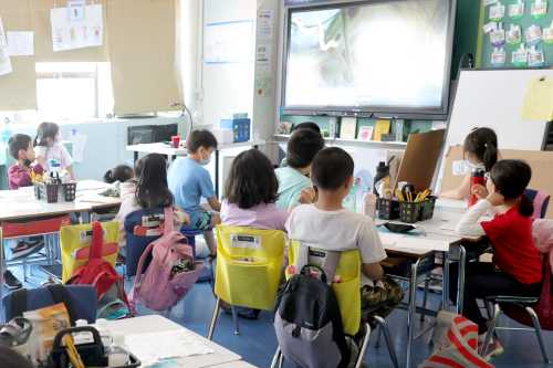NEW YORK, NEW YORK - JUNE 24: Students attend class on the second to last day of school as New York City public schools prepare to wrap up the year at Yung Wing School P.S. 124 on June 24, 2022 in New York City. Approximately 75% of NYC public schools enrolled fewer students for the 2021/2022 school year due to the pandemic. (Photo by Michael Loccisano/Getty Images)