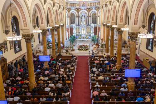 BALTIMORE, MARYLAND - MARCH 31: Parishioners of Sacred Heart of Jesus and Saint Patrick take part in Easter Sunday mass on March 31, 2024, in Baltimore, Maryland.