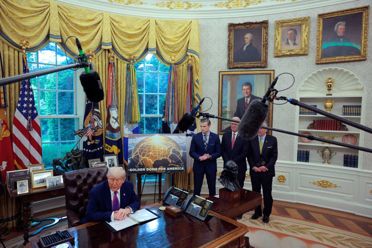 U.S. President Donald Trump speaks alongside Secretary of Defense Pete Hegseth, Sen. Kevin Cramer (R-ND) and Sen. Dan Sullivan (R-AK) in the Oval Office at the White House on May 20, 2025 in Washington, DC. President Trump announced his plans for the "Golden Dome," a national ballistic and cruise missile defense system.