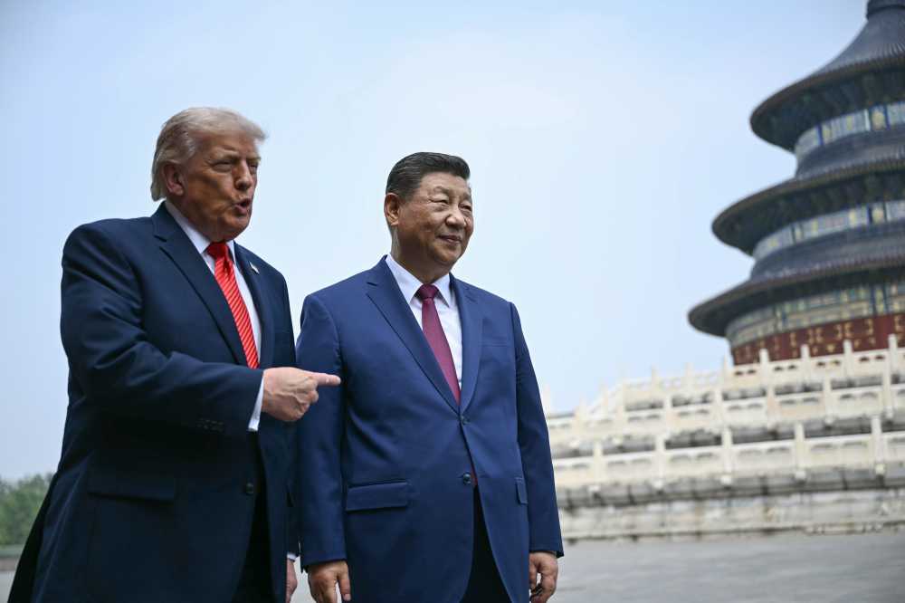 China's President Xi Jinping (R) and US President Donald Trump visit the Temple of Heaven on May 14, 2026 in Beijing, China.