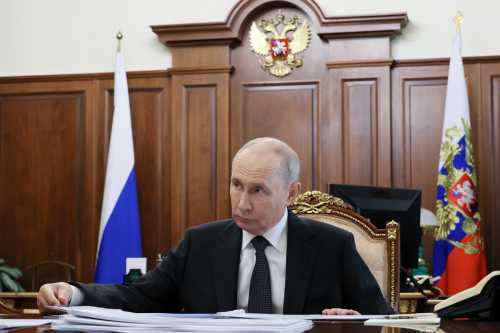 In this pool photograph distributed by the Russian state agency Sputnik, Russia's President Vladimir Putin attends a meeting with the governor of Novgorod region in Moscow on September 14, 2026.