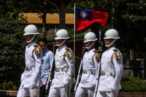 Members of an honour guard perform during a ceremony for the changing of the honour guard at the National Revolutionary Martyrs' Shrine in Taipei on September 23, 2026.