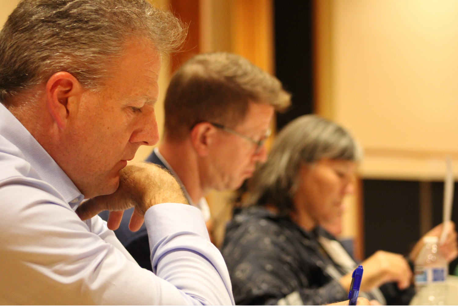 Commission members listen during the field hearing. (Governor Chris Sununu, Derek Kilmer, and Valerie Nurr'araaluk Davidson.)