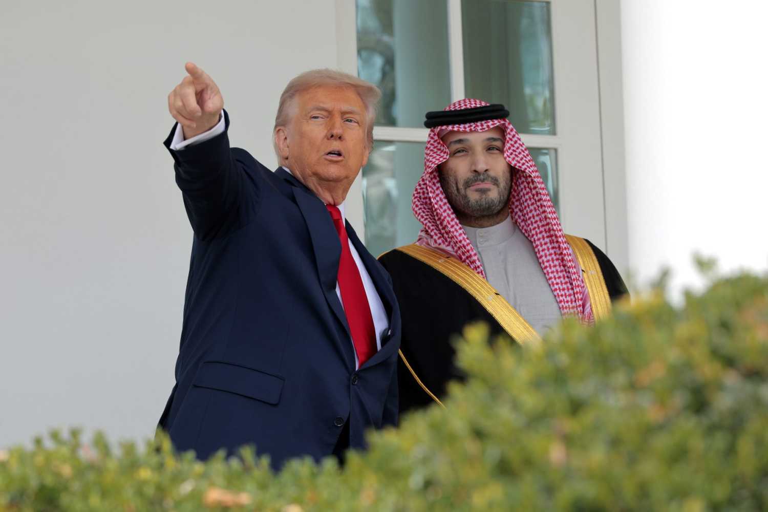U.S. President Donald Trump (L) gestures as he speaks with Crown Prince and Prime Minister Mohammed bin Salman of Saudi Arabia at the White House on November 18, 2025, in Washington, DC. Trump is hosting the crown prince for meetings aimed at strengthening economic and defense ties, including the U.S. sale of F-35 fighter jets to Saudi Arabia.