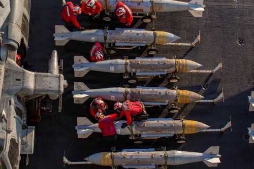 In this U.S. Navy released handout, U.S. Sailors prepare to stage ordnance on the flight deck of Nimitz-class aircraft carrier USS Abraham Lincoln (CVN 72) in support of Operation Epic Fury on February 28, 2026 at Sea.