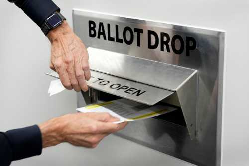 DES MOINES, IOWA - OCTOBER 14: A voter casts his ballot during early voting at the Polk County Election Office on Oct. 14, 2026, in Des Moines, Iowa.