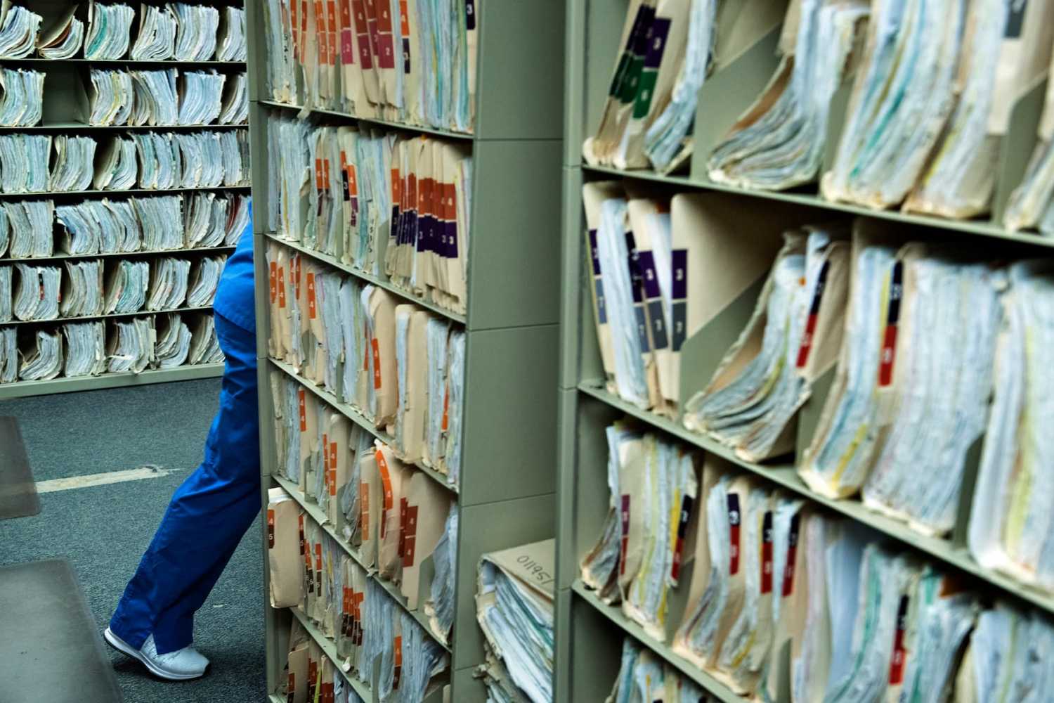 A staff member walks past medical records at the Cornerstone Care Community Health Center of Rogersville March 21, 2017, in Rogersville, Pennsylvania.