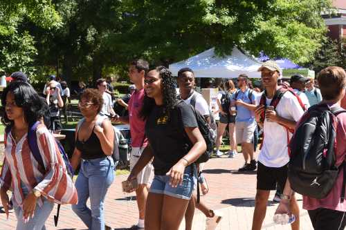 Greenville, North Carolina/United States- 08/30/2018: A group of African American college students walk across campus between classes.