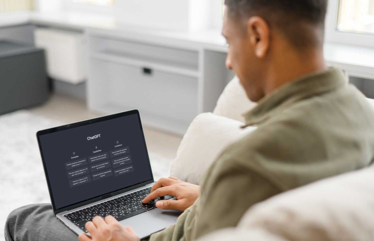 Man on laptop using ChatGPT